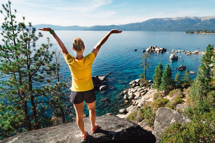 A lady stands overlooking Lake Tahoe in Northern California