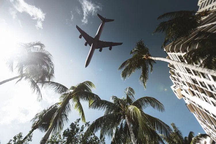 Plane landing in Miami a top multi centre holiday destination. Twin center.