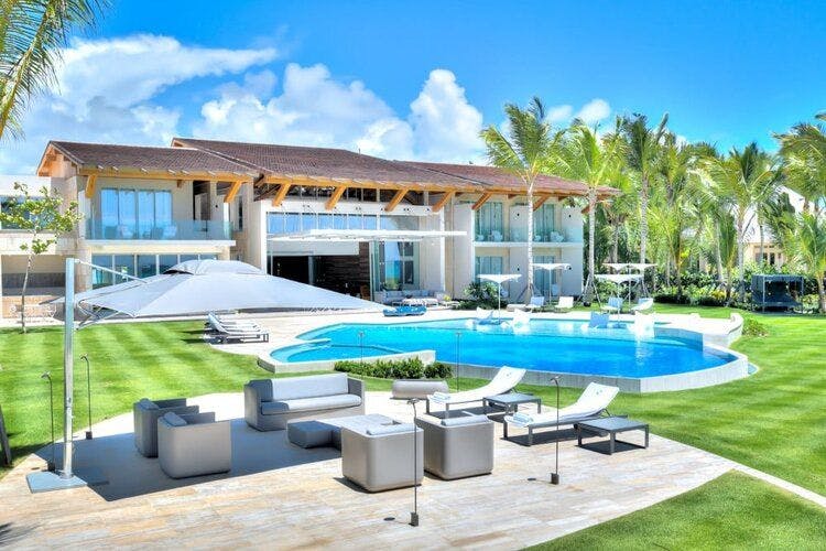 Poolside view of Punta Cana Resort and Club 35. New resort villa in Dominican Republic