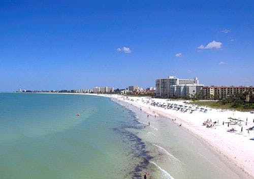 White sand beach with apartments along the sand in Florida