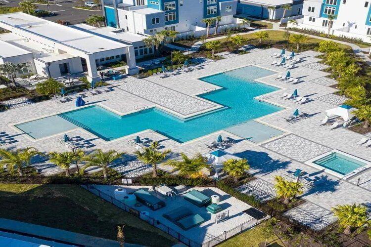 An aerial view of the Spectrum Resort clubhouse and pool