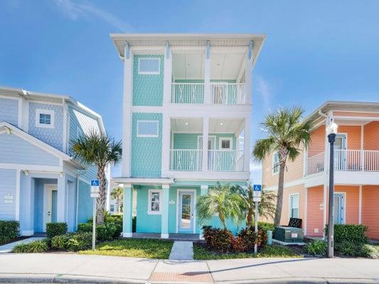 Margaritaville 272 Accommodation for sports teams exterior of pale blue house with 3 storeys