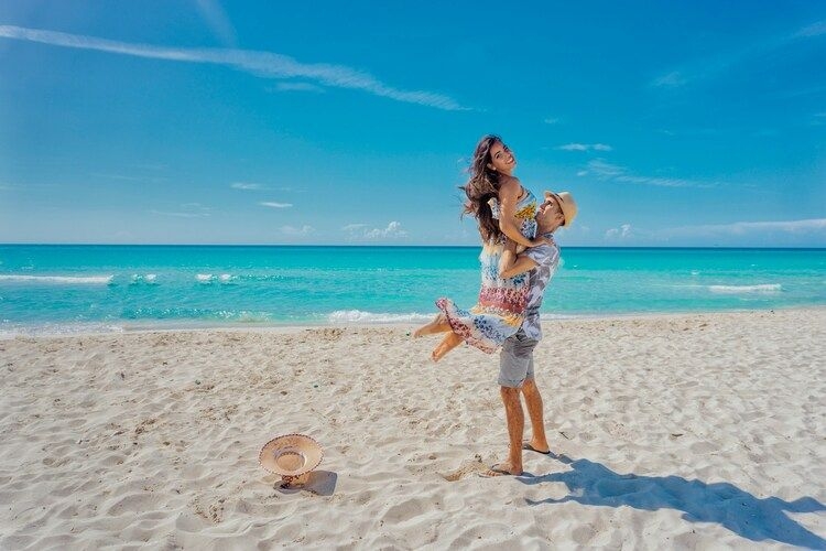 60 things to do in the Turks and Caicos, couple on the beach, Top Villas