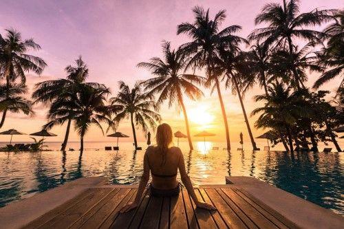 A swimmer relaxed by the pool of the oceanfront beach club in Jamaica