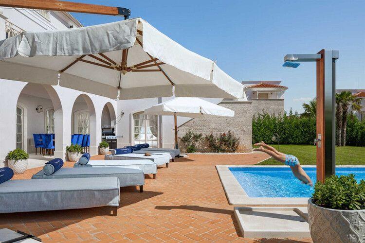 Vabriga villas with private pools, Vabriga 7 person diving into luxury pool, Top Villas