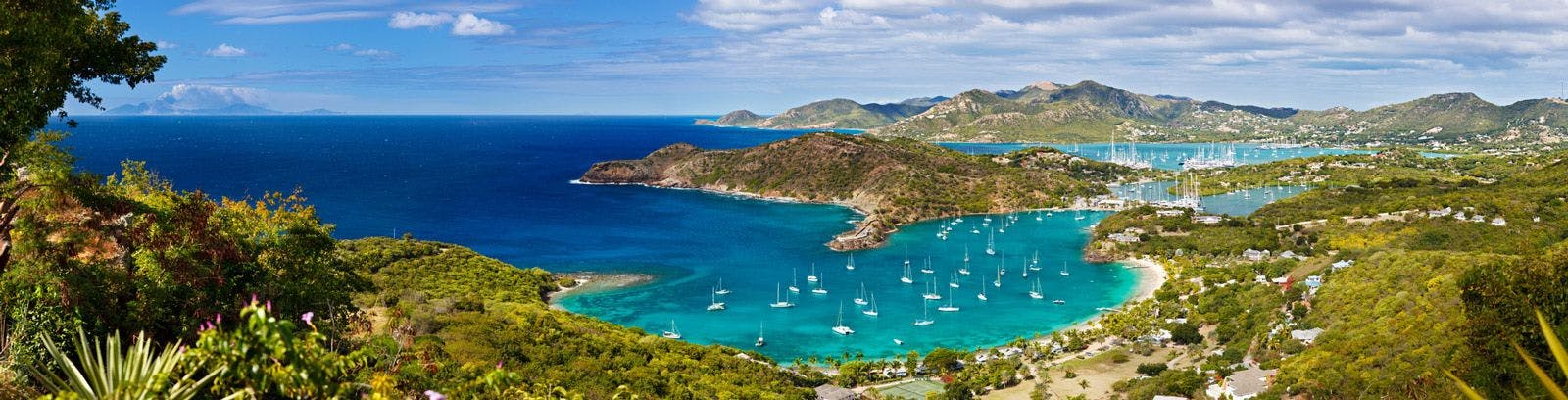 English Harbor in Antigua with sailboats in the natural harbor