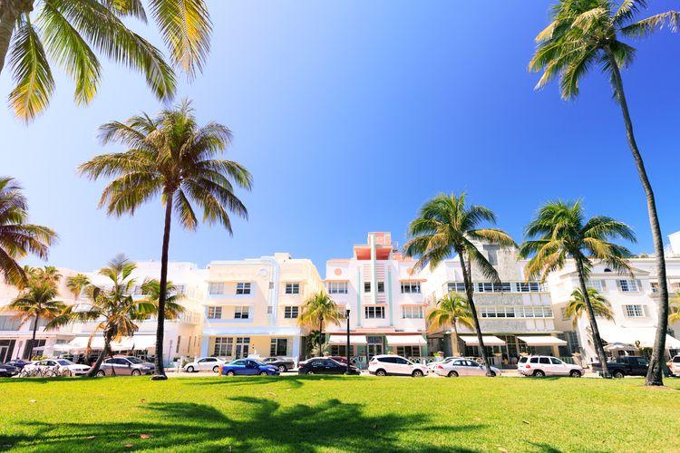 Pastel colored Art deco buildings against a blue sky in Miami