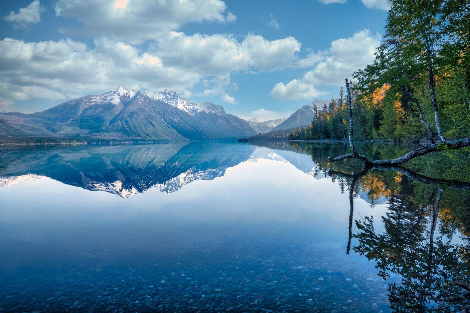 Montana landscape with snow-capped mountain reflected in still lake