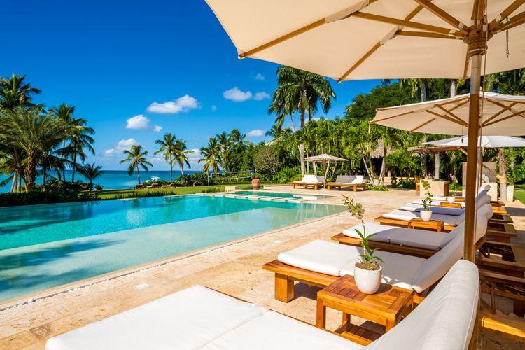 Dominican Republic villas on the ebach Casa De Campo 66 private pool with sun loungers and parasols with sea view