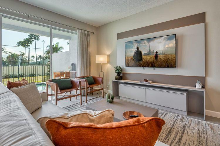 Formosa Valley townhomes - Formosa Valley Resort 19 lounge room with sofa, armchairs and large widescreen tv on the wall