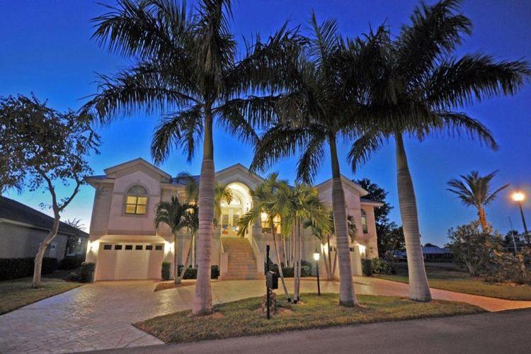 Fort Myers 5 vacation rental with palm trees out front