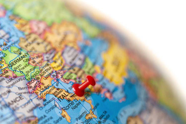 Globe showing pin on Italy
