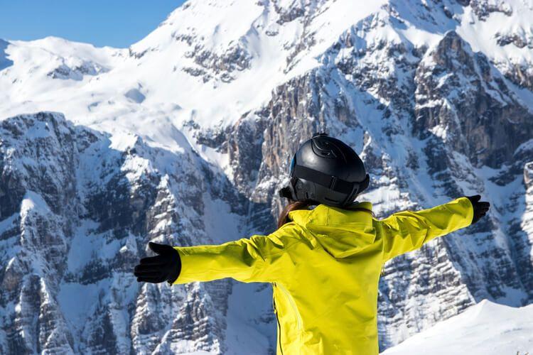 A skier takes in the views of Mammoth Lakes