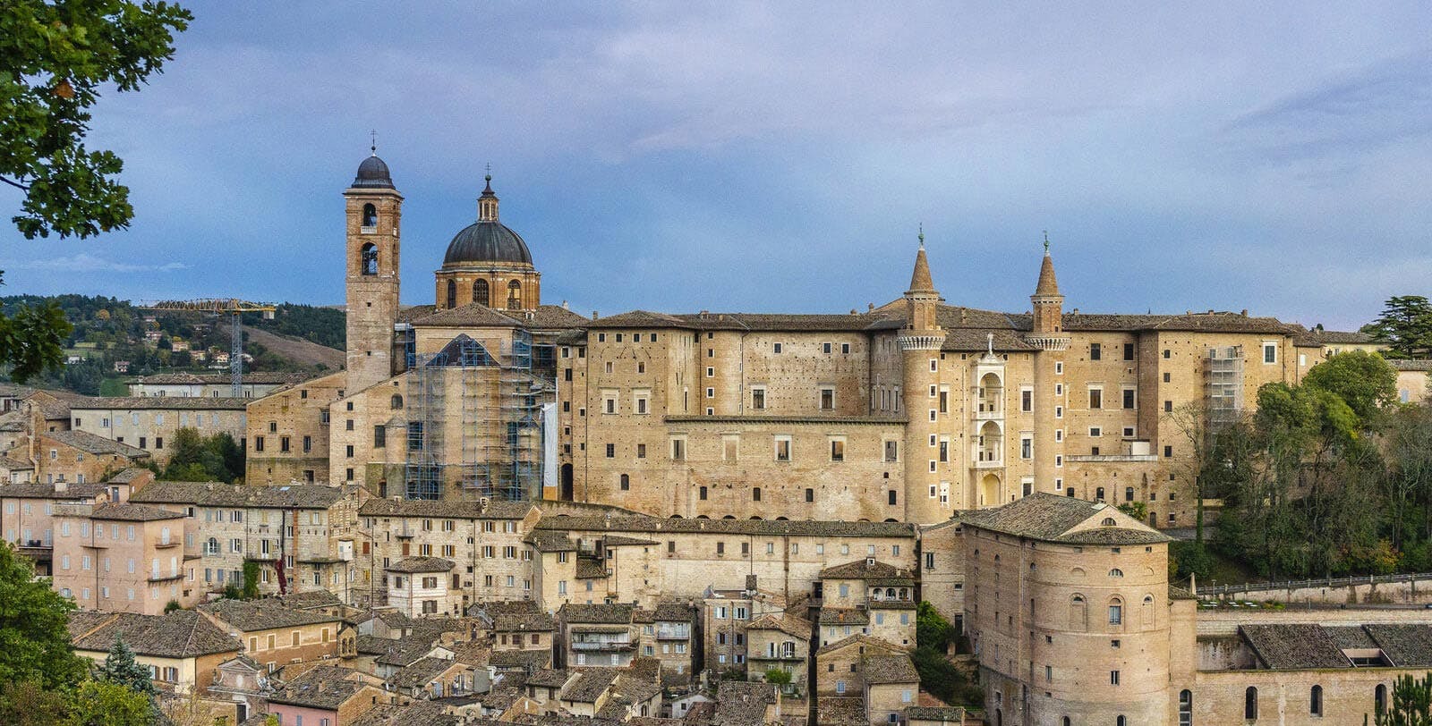 Traditional town in Le Marche with domed church and stone town walls