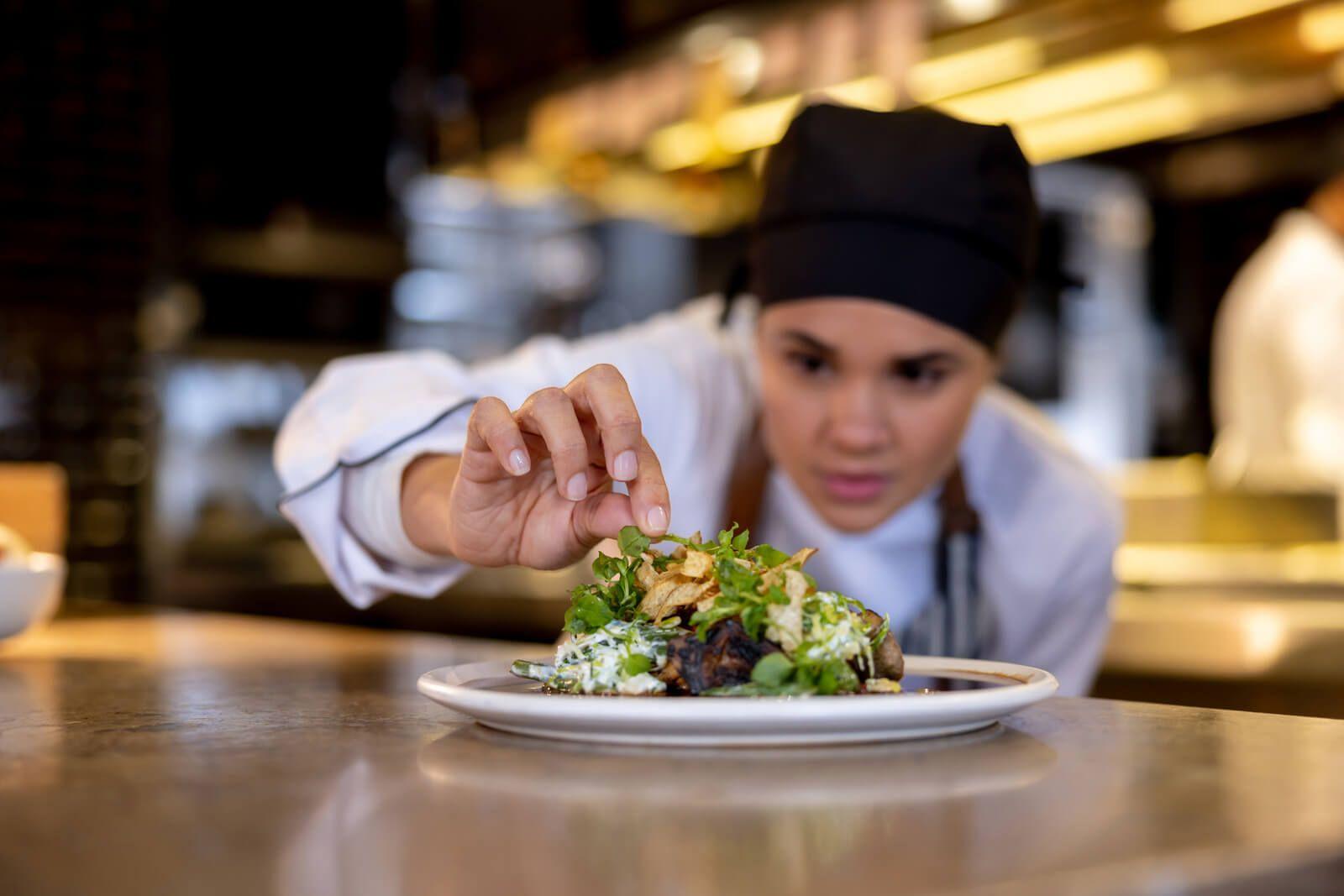 A private chef preparing a dish