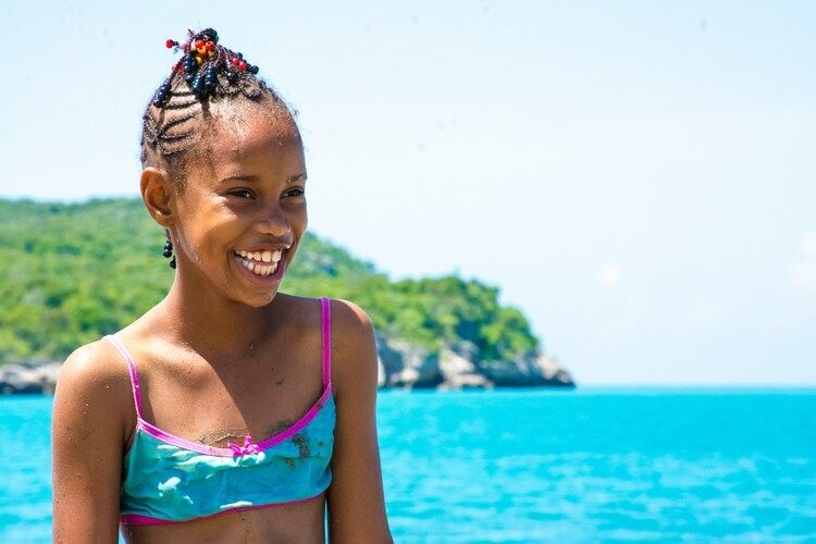 Best time to visit Jamaica, happy child on beach