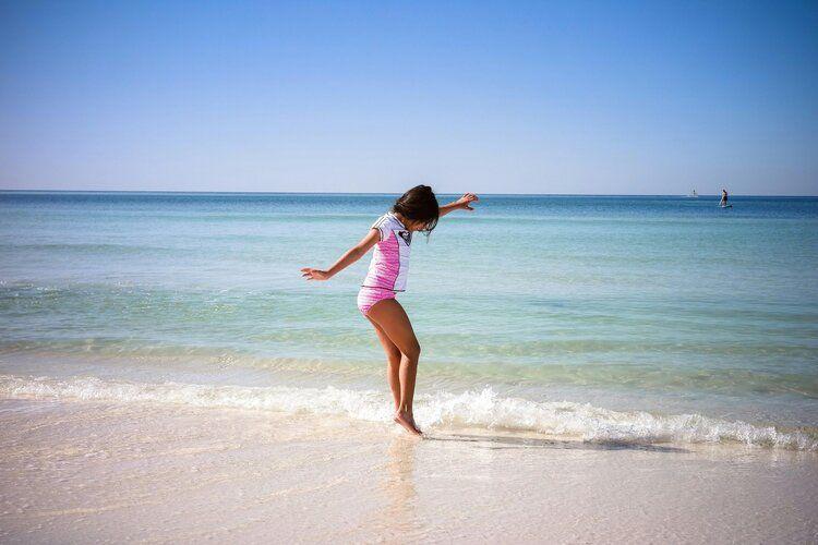 Girl enjoys the Gulf coast shoreline in Seacrest Florida