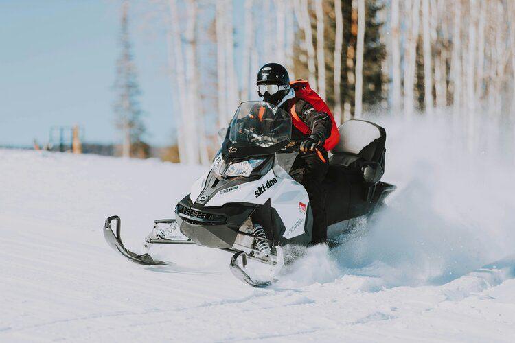 Concierge for ski holidays, snow mobile in the snow