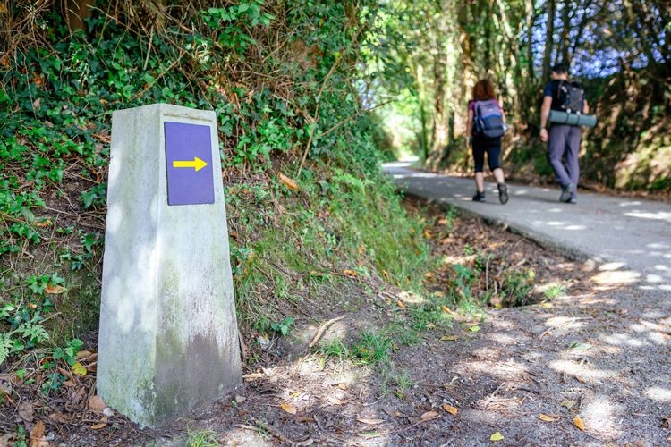 A couple hiking along a marked path in Barbados