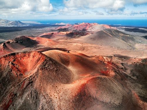 View of the red and black volcanic landscape of Timanfaya National park