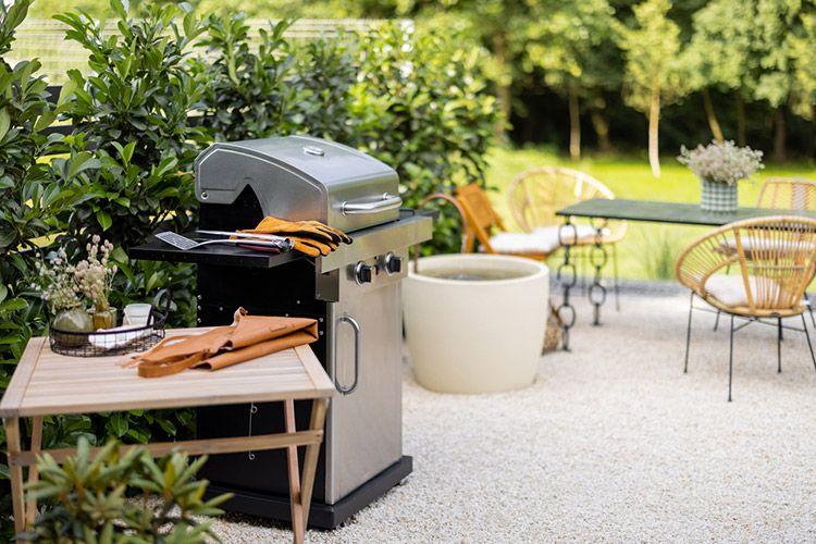 An outdoor barbeque grill with gloves and table, Concierge services