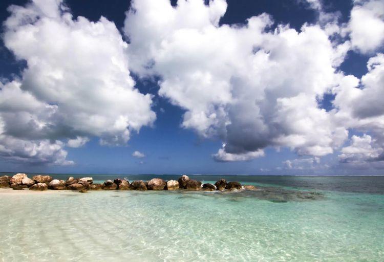 Babalua Beach with rocky strip in the water