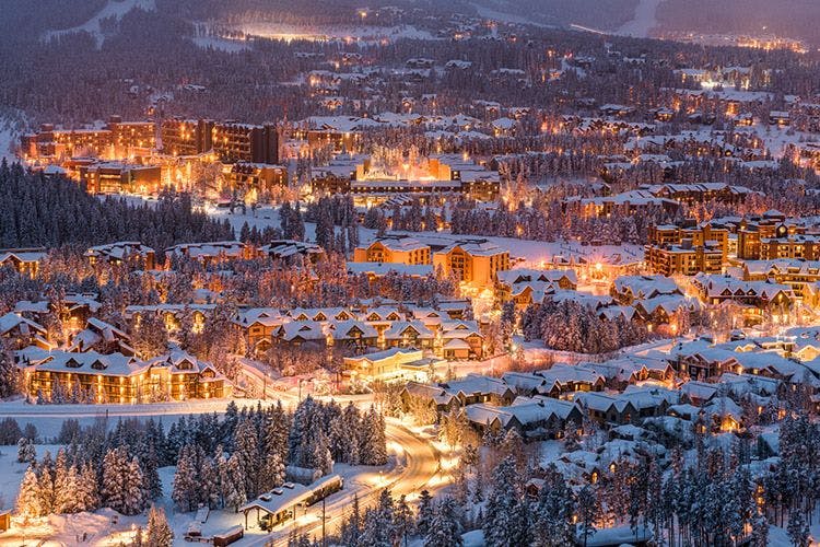 Breckenridge town lit up at night with snow all round
