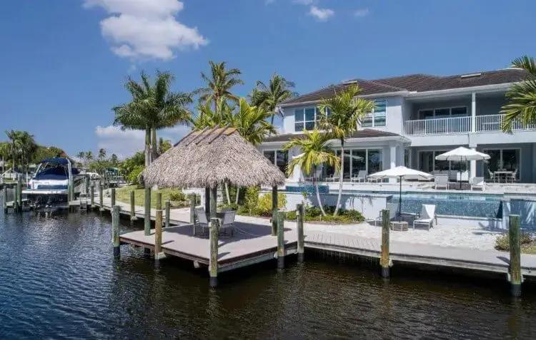 A villa on the canal waterside with a boat jetty