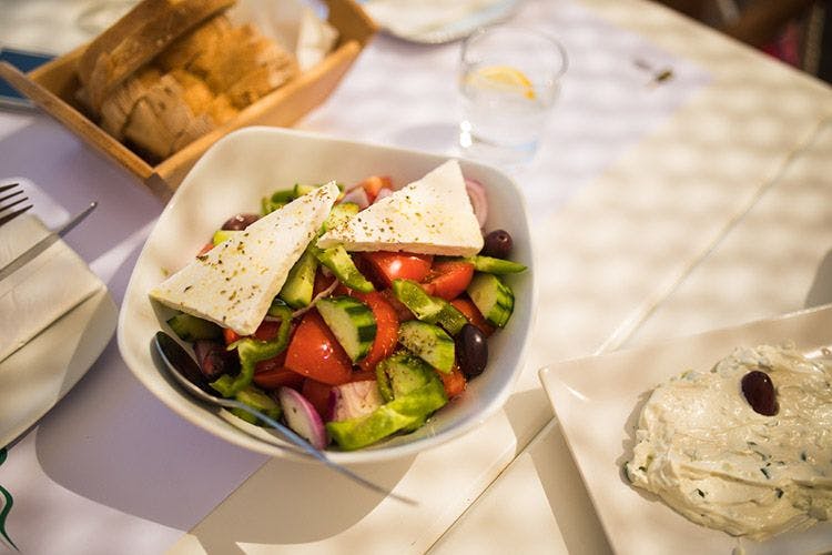 A Greek salad with tomatoes, cucumbers, and feta cheese
