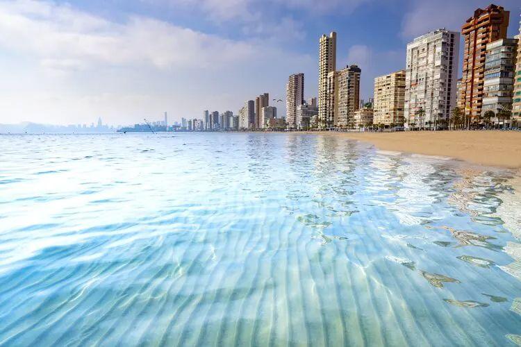 Benidorm city with high rise buildings along a white sand beach