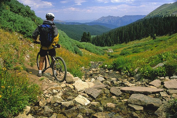 A man cycling on a mountain in Colorado