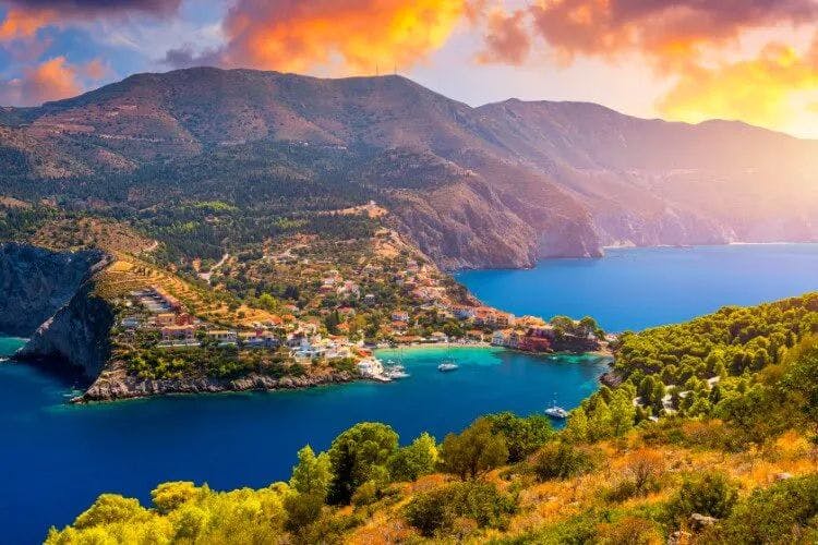 Town on the rocky coast of Kefalonia at sunset