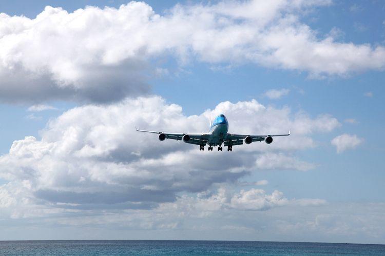 Plane coming in to land over the sea