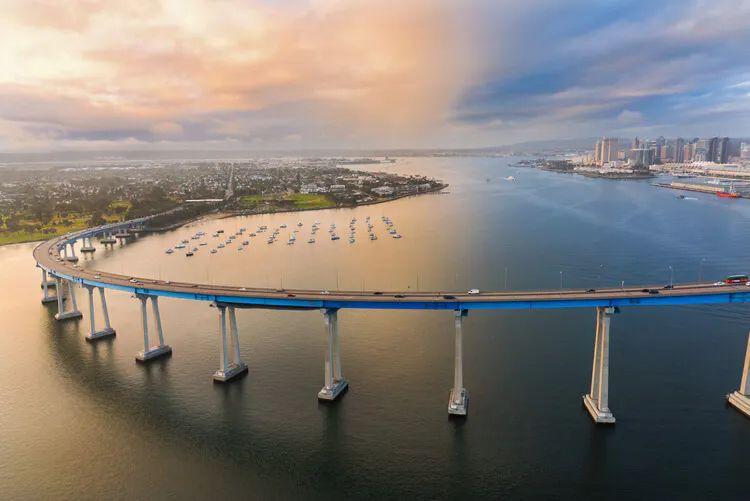 A large curved bridge sweeping over San Francisco Bay