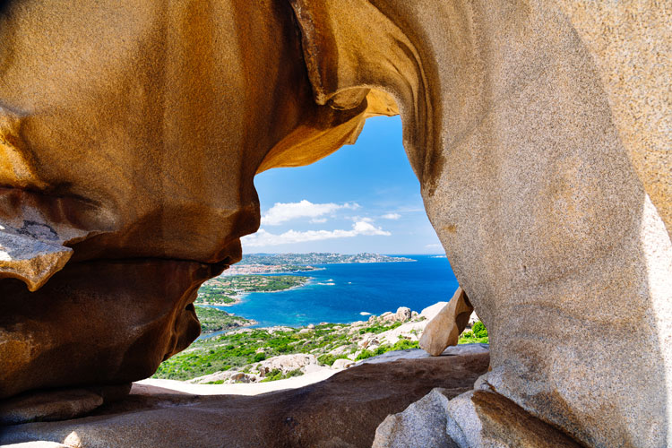 View through cave of coastline of Sardinia - Best places to visit in January