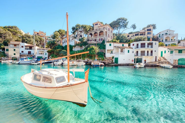 Small fishing boat in a harbor in Mallorca - The best places to visit in June